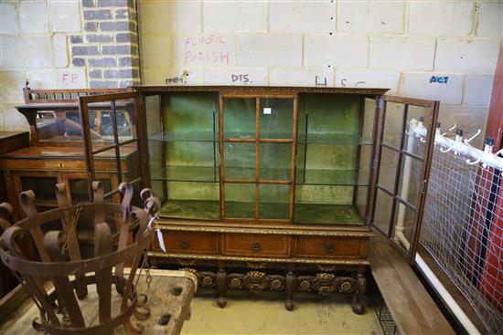 An early 20th century George I style parcel gilt walnut display cabinet, W.148cm, D.44cm, H.148cm